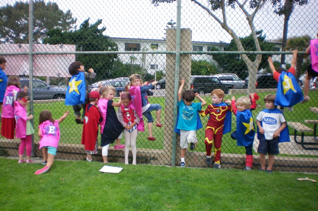 Super heros climbing thee fence